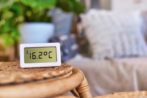 Digital thermometer showing too cold room temperature of 16.7 degree Celsius