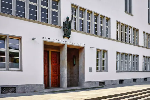 stock image Heidelberg, Germany - June 28th 2024: Front of main building of Ruprecht-Karls-University with statue of Roman goddess of wisdom Minerva above entrance