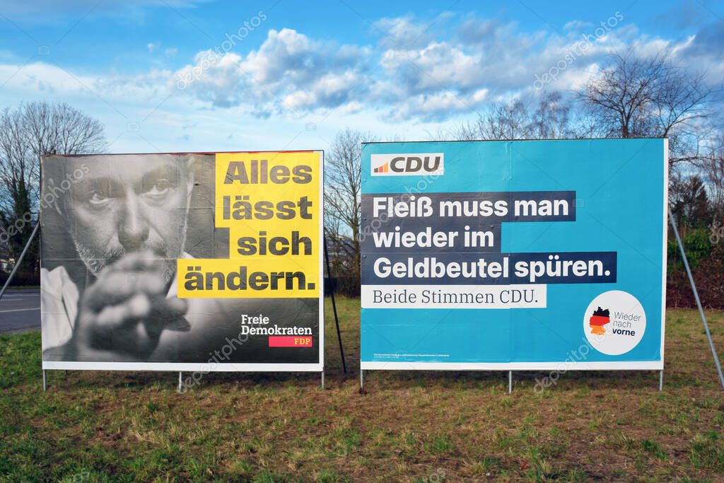 Heidelberg, Germany - January 25th 2025: Election poster billboards for federal parliament  election 'Bundestagswahl' 2025 with advertisements for political parties CDU and FDP
