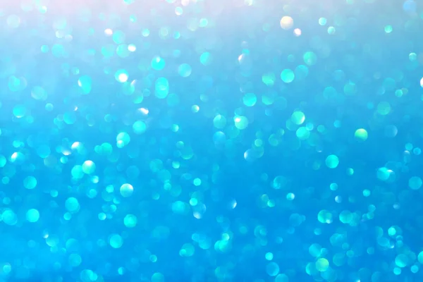 Blue bright defocused background. Christmas, New Year, Spring or Summer Holidays. Copy space