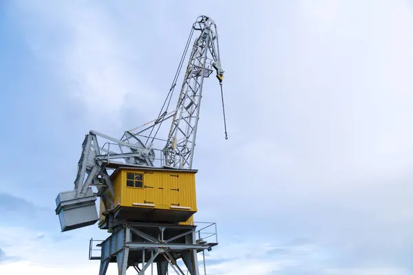 stock image View of a port crane in the old industrial area of the town of San Esteban de Pravia, Asturias, Spain