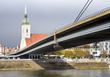 SNP Bridge and St. Martin's Cathedral in Bratislava, Slovakia.