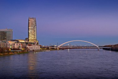 Danube embankment in the evening in Bratislava, Eurovea Tower, Slovakia.