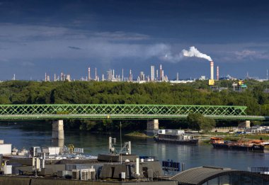 Slovnaft refinery in Bratislava, Old Bridge on Danube, Slovakia. clipart