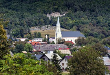 Village Muran near Muranska Plateau, parish church of St. Juraj, Slovakia. clipart