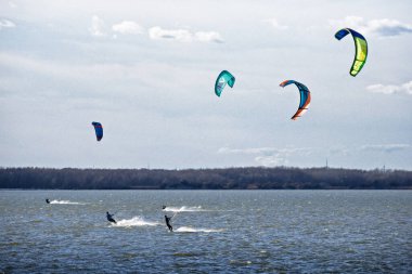 Kiteboarding at the Cunovo dam, Danube River, Bratislava, Slovakia. clipart