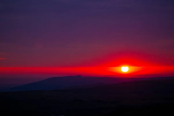 Sunset landscape. colorful horizon, big bright sun, beautiful nature