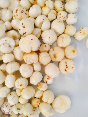 Makhana, also called as Lotus Seeds or Fox Nuts are popular dry snacks from India, isolated on white background