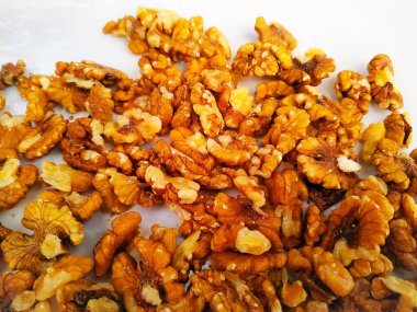 Walnut pieces isolated on white background. Top view.