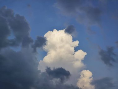 Clouds in the blue sky before a thunder-storm, India. clipart