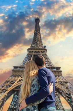 Couple woman and man near the eiffel tower. Selective focus. People.