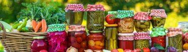 Jars with preserved vegetables for the winter. Selective focus. Food.