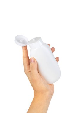 Kozmetik ürünler bir kadının ellerinde izole edilir. Seçici odaklanma. beyaz.