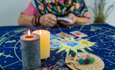 Fortune teller reads tarot cards. selective focus. Old. clipart