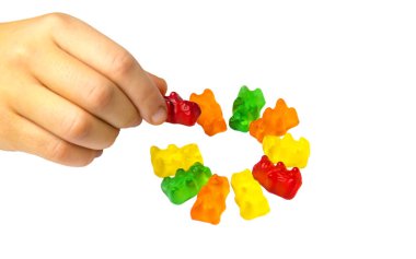 Jöle vitaminleri oyuncak ayılar beyaz arka planda izole edilir. Seçici odaklanma. Çocuk.