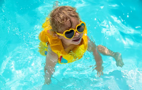 Child Swims Pool Vest Selective Focus Kid — Stock Photo, Image