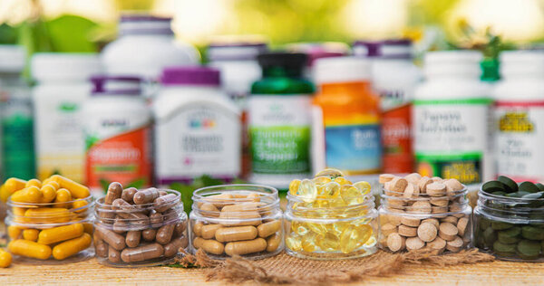 Kyiv, Ukraine - 07. 07. 2023. Supplements in jars with iHerb. Selective focus Nature