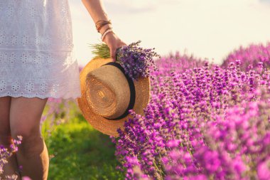 Woman in a lavender field. Selective focus. Nature.