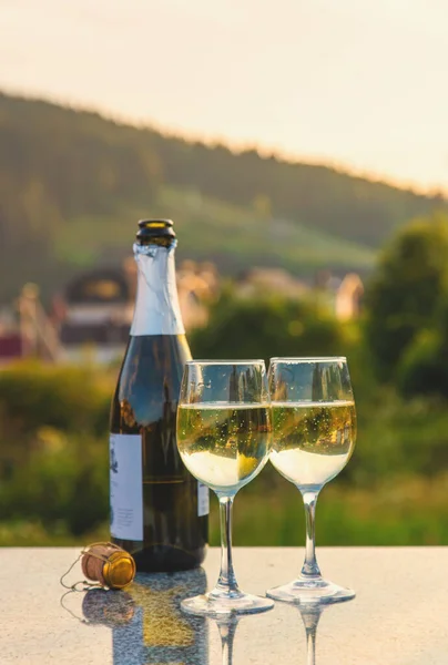 Glasses of wine against the background of mountains. Selective focus. Nature.