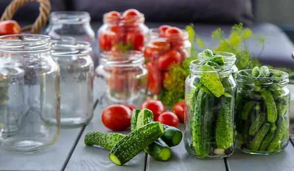 Preserving tomatoes in jars. Selective focus. Food.