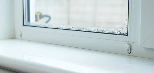 stock image Moisture on a plastic window. Selective focus. Home.