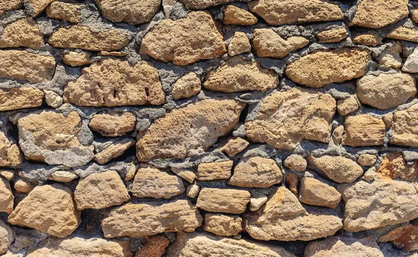 Taş duvar dokusu arka plan. Seçici odaklanma. Doğa.
