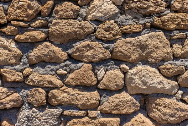Taş duvar dokusu arka plan. Seçici odaklanma. Doğa.