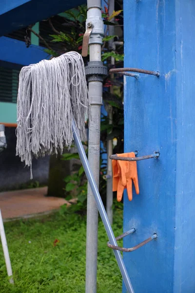 stock image Mop and rubber gloves for environmental cleaning tools.