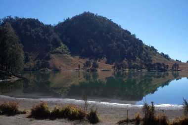 Lake Ranu Kumbolo, a source of clean water for the climbers of Mount Semeru, located in the Bromo Tengger Semeru National Park area. clipart