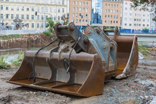 Stock image Excavator buckets on the bank of the river Svratka, Brno, Czech republic, floods after storm Boris, September 15, 2024.