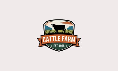 Farm logo with a cow in a shield, fields, and mountains clipart