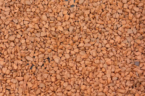 Renkli kırmızı ve kahverengi moloz yığını. Arkaplan ve doku