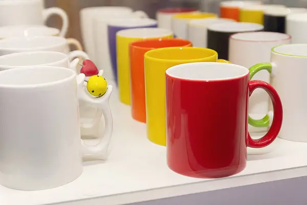 stock image Colorful mug stall in a store closeup. Industry