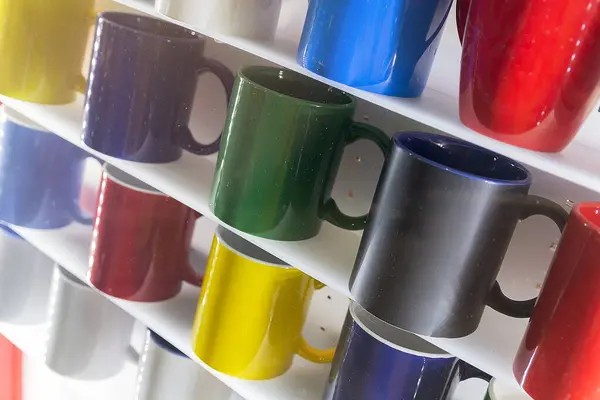 stock image Colorful mug stall in a store closeup. Industry