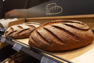 Fresh breads on a counter of the grocery store. Food