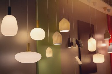 Various modern chandeliers from the exhibition hall. Interior