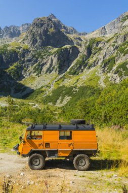 Tatranske Matliare, Slovakia - September 05, 2024: Steyr-Puch Pinzgauer 710 truck supplying a shelter Chata pri Zelenom plese in the Tatra Mountains. clipart