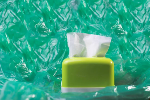 tissue in a green tissue box green background