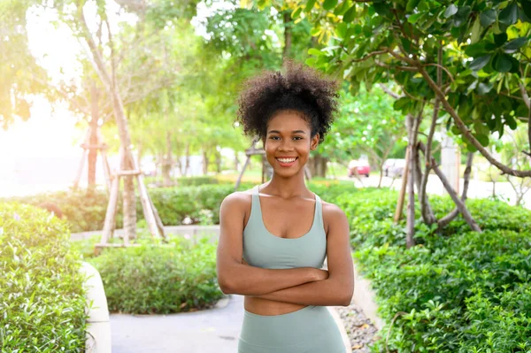 stock image Portrait of black woman, afro hairstyle in outdoor park. Beautiful African woman preparing, practicing, training, sport, lifestyle, summer mood concept