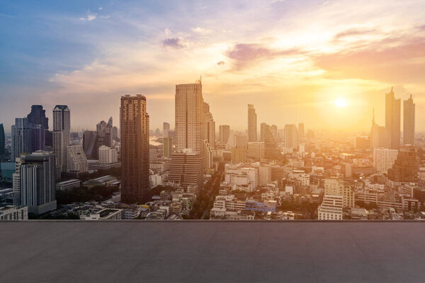 cityscape and skyline of Bangkok urban in twilight time on view from empty concrete floor