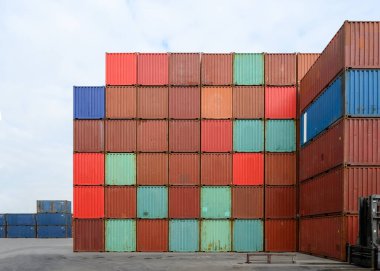 cargo containers stacked in industrial container yards for logistic import export business
