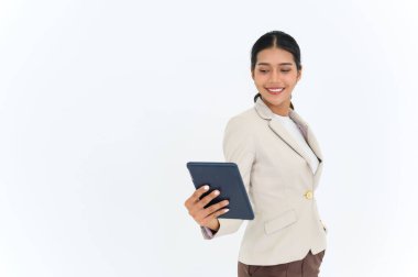 portrait of cheerful attractive young businesswoman standing and using digital tablet isolated over white background