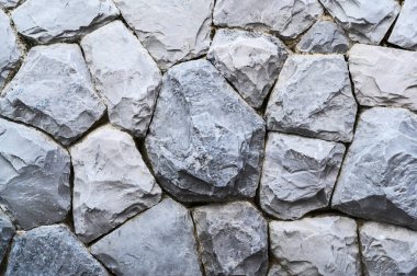 Bir taş duvarın parçası, arkaplan veya dokunun gri rengi, modern tarz tasarım dekorasyonu
