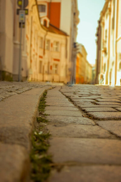 Empty narrow street at dawn. Selective focus. The concept of urban tourism.