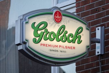 Hardenberg, Netherlands - Jan 8 2023 Illuminated advertising sign of Grolsch, a beer brand from the Netherlands, which exists since 1615