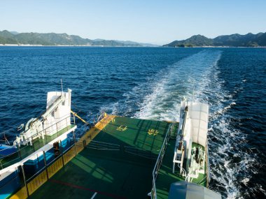 Hiroshima, Japan - August 25, 2018: On board of a car ferry returning to Hiroshima port from Etajima island clipart