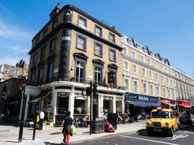 London, UK - June 06, 2018: Shops and cafes on Queensway road in the vicinity of Bayswater station clipart