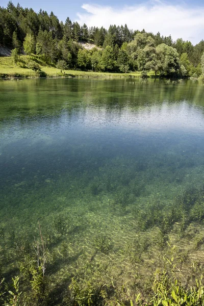 stock image Beautiful, turquoise coloured Korana river, flowing through the green forests of Lika, mountain region of Croatia near famous Plitvice lakes