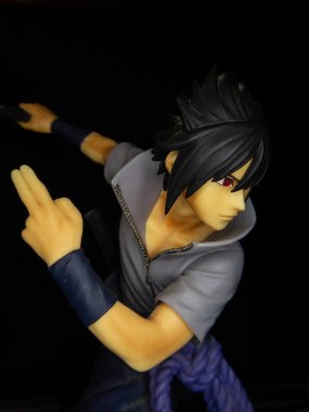 This image showcases a vibrant action figure of a character in a dramatic pose, emphasizing their intensity and style. Perfect for themes related to anime, manga, action, and collectible figures. clipart