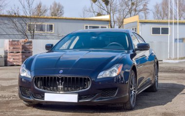 Lviv Ukraine - 03 04 2023: Blue Maserati quattroporte, Italian luxury car, speed and comfort of modern cars clipart